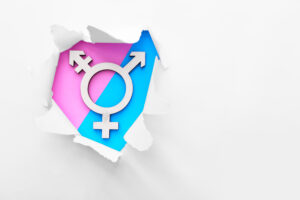 Transgendersymbol auf rosa und blauem Hintergrund